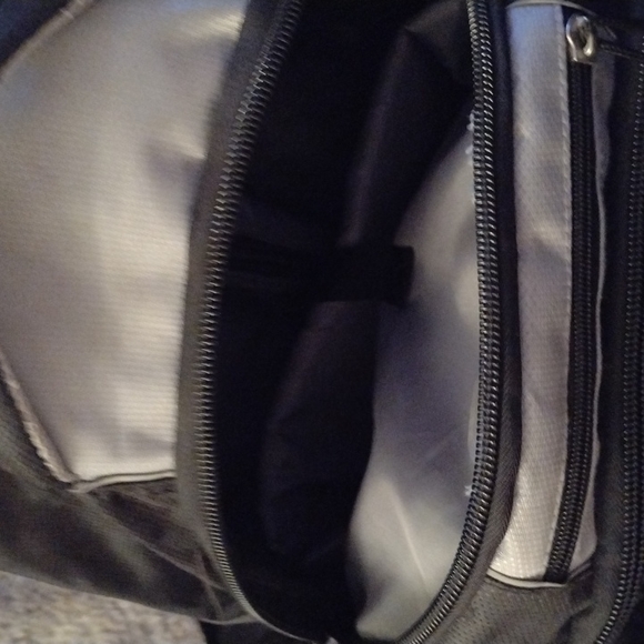 ROOTS WHEELED CARRY ON.  NUMEROUS COMPARTMENTS.  GENTLY USED. - Picture 7 of 9